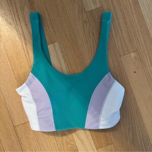 NWOT WILO teal, white, and lavender purple color block sports bra. Size medium.